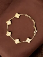 Clover Petal Grace – Golden Floral Charm Bracelet