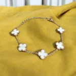 Golden Grace Clover – Elegant White Motif Charm Bracelet