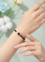 Noir Elegance – Black & Gold Clover Statement Bracelet - Image 2